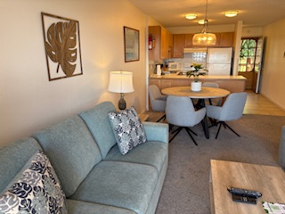 3411 Wilcox Road, Unit IIII109 Lihue, HI 96766 - Photo 2 of 12 a living room with furniture and a wooden floor
