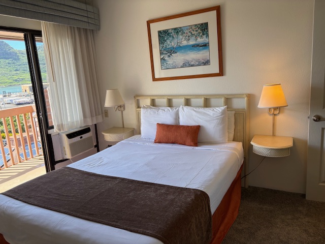 3411 Wilcox Road, Unit IIII109 Lihue, HI 96766 - Photo 4 of 12 a bedroom with a bed and a window