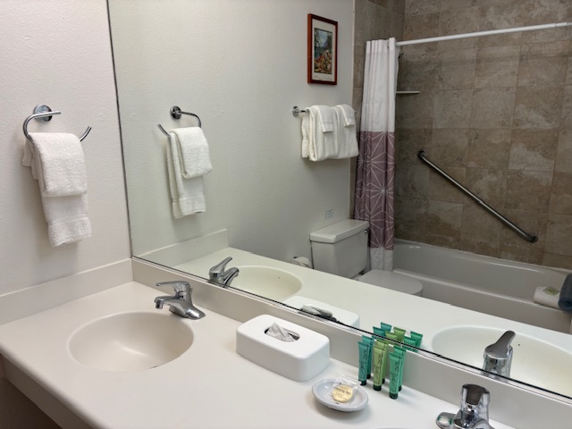 3411 Wilcox Road, Unit IIII109 Lihue, HI 96766 - Photo 6 of 12 a bathroom with a sink and a mirror
