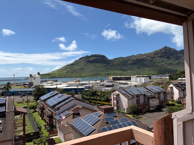 3411 Wilcox Road, Unit IIII109 Lihue, HI 96766 - Photo 9 of 12 a view of houses with city skyline