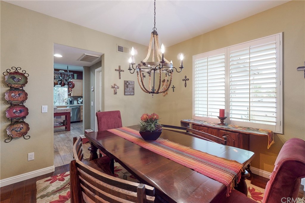 3199 Toopal Drive Oceanside, CA 92058 - Photo 11 of 47 a view of a dining room with furniture and chandelier