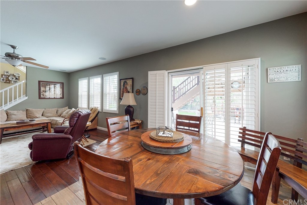 3199 Toopal Drive Oceanside, CA 92058 - Photo 19 of 47 a living room with furniture a large window and a dining table