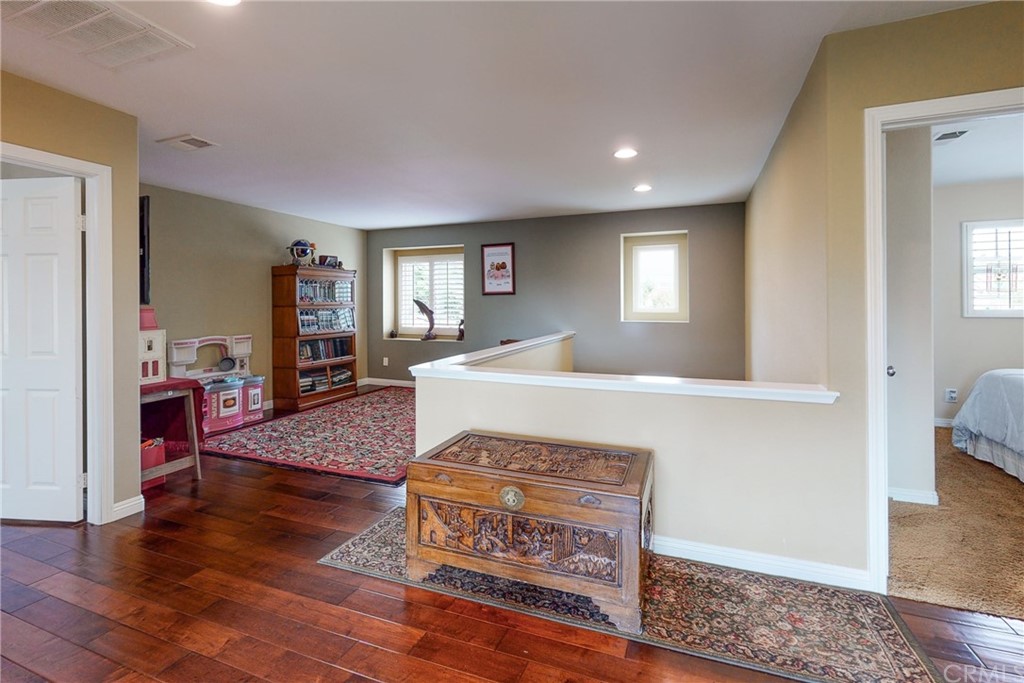 3199 Toopal Drive Oceanside, CA 92058 - Photo 25 of 47 a living room with furniture and a wooden floor