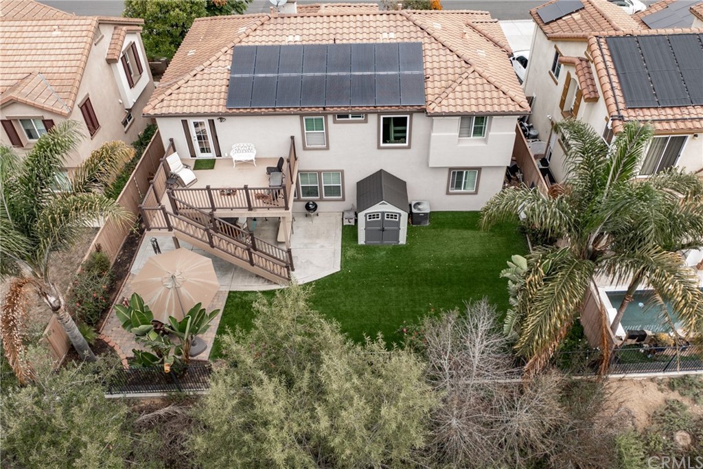 3199 Toopal Drive Oceanside, CA 92058 - Photo 4 of 47 a view of a white house with a yard and sitting area