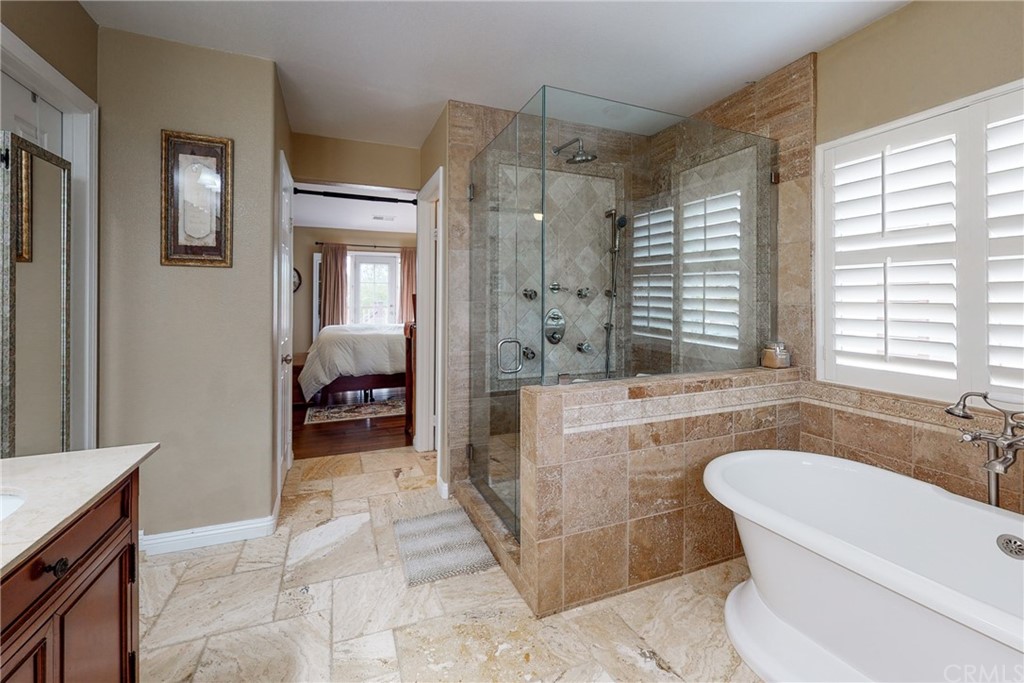 3199 Toopal Drive Oceanside, CA 92058 - Photo 31 of 47 a spacious bathroom with a tub sink and mirror