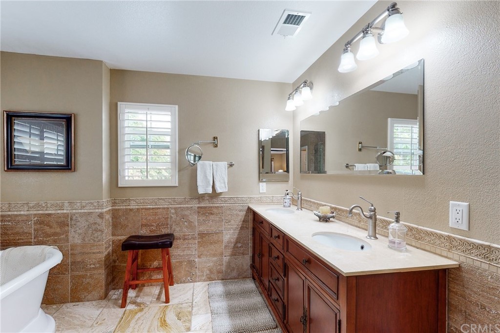 3199 Toopal Drive Oceanside, CA 92058 - Photo 33 of 47 a bathroom with a sink and a mirror