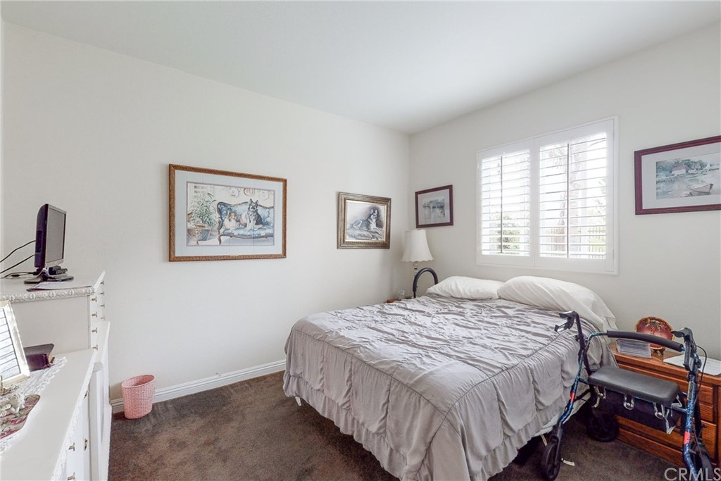 3199 Toopal Drive Oceanside, CA 92058 - Photo 34 of 47 a bedroom with a bed and a dresser