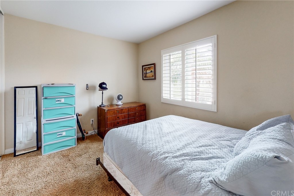 3199 Toopal Drive Oceanside, CA 92058 - Photo 35 of 47 a bedroom with a bed and a window