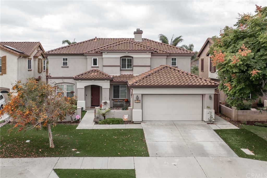 3199 Toopal Drive Oceanside, CA 92058 - Photo 5 of 47 a front view of a house with garden