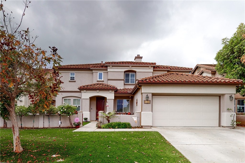 3199 Toopal Drive Oceanside, CA 92058 - Photo 42 of 47 a front view of a house with a garden and plants
