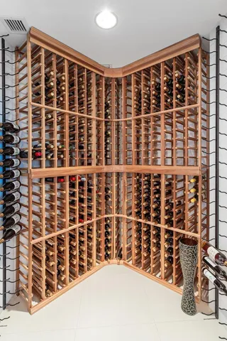 a spacious bathroom with a granite countertop sink a mirror and shower