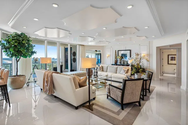 a bathroom with a granite countertop sink mirror vanity and toilet