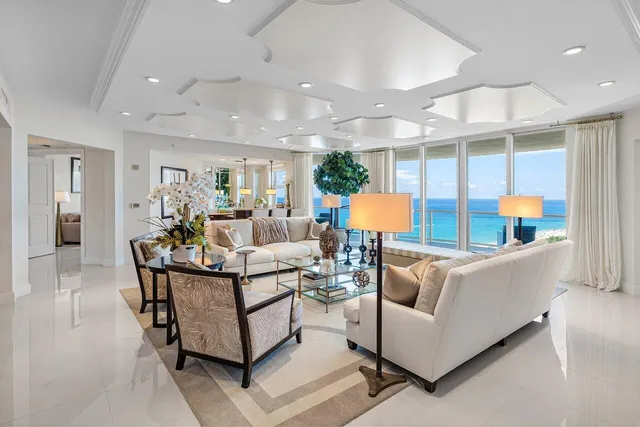 a bedroom with a bed couch and a flat screen tv