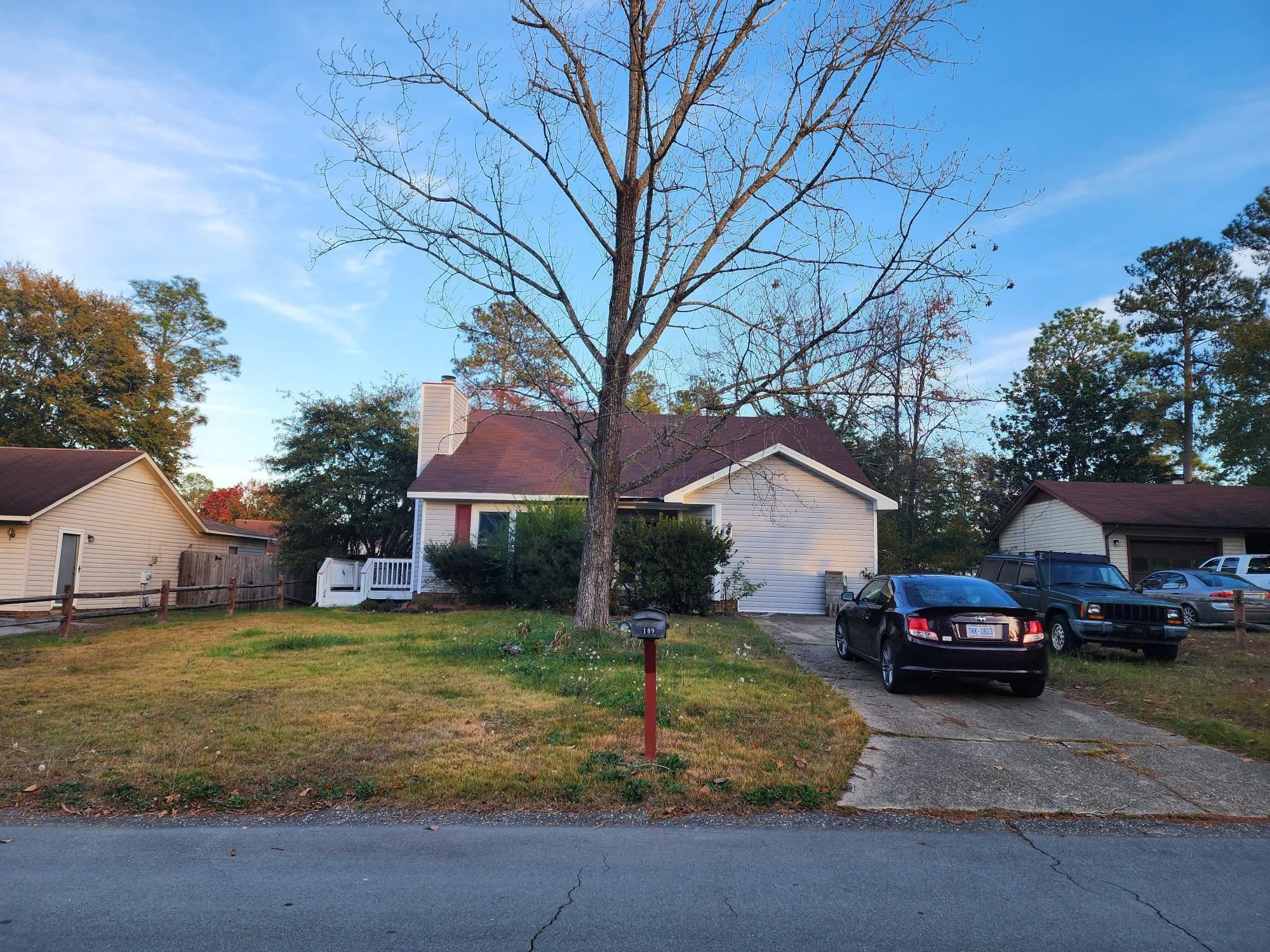 a front view of a house with a yard