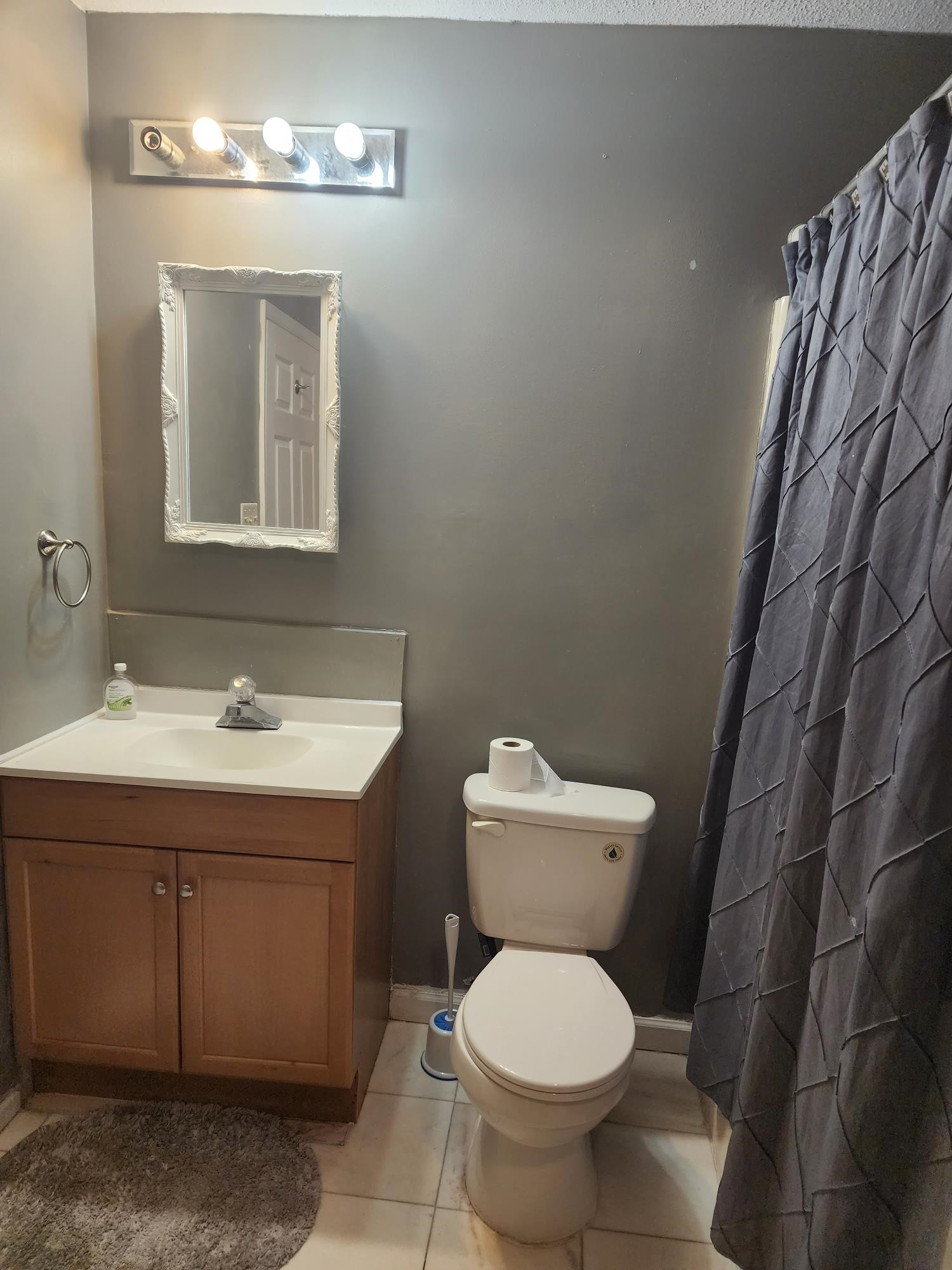 109 Marvin Drive Spring Lake, NC 28390 - Photo 8 of 13 a bathroom with a toilet sink and mirror