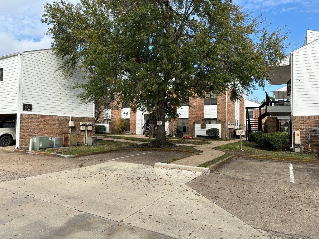 7901 Cambridge Street, Unit 133 Houston, TX 77054 - Photo 11 of 14 a view of a street with a large tree