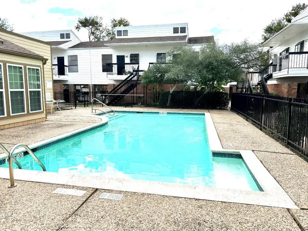 a view of a house with backyard sitting area