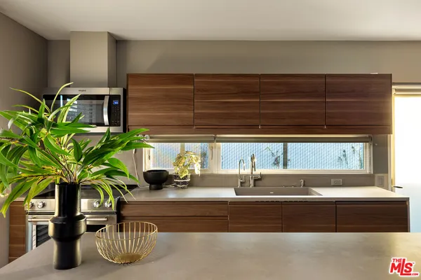 a view of a house with a tree