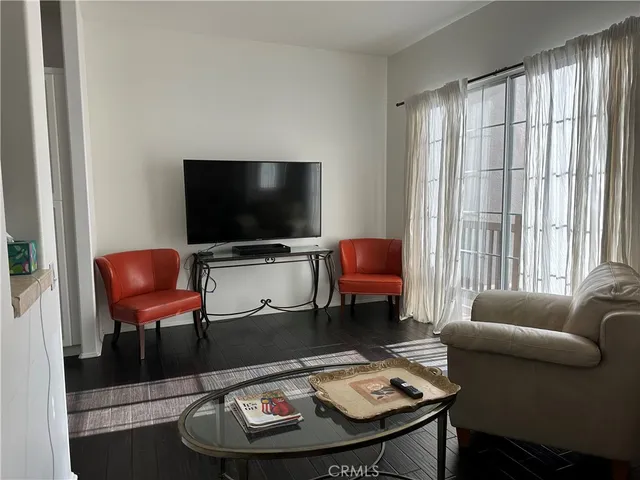 a lobby with furniture and floor to ceiling window