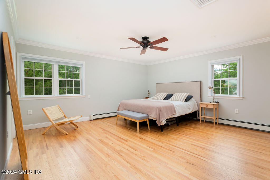 25 Griffith Road Riverside, CT 06878 - Photo 12 of 27 a bedroom with a bed and wooden floor