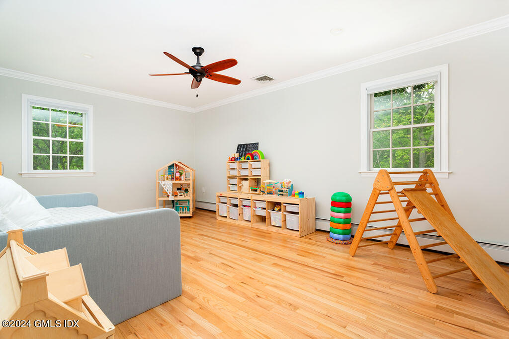 25 Griffith Road Riverside, CT 06878 - Photo 16 of 27 a living room with furniture and a wooden floor