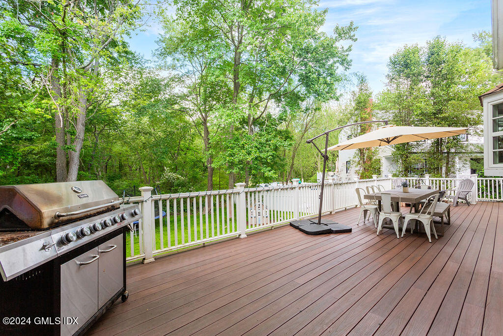 25 Griffith Road Riverside, CT 06878 - Photo 2 of 27 a view of a patio with a table chairs and a barbeque