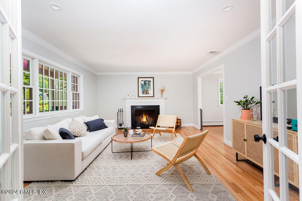 25 Griffith Road Riverside, CT 06878 - Photo 4 of 27 a living room with furniture and a fireplace