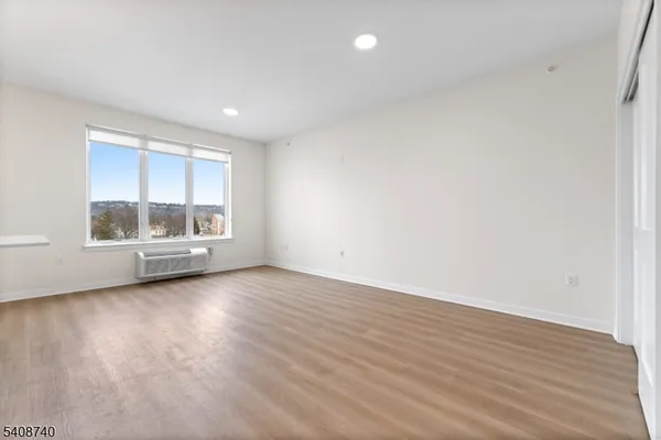 a view of kitchen view wooden floor and window