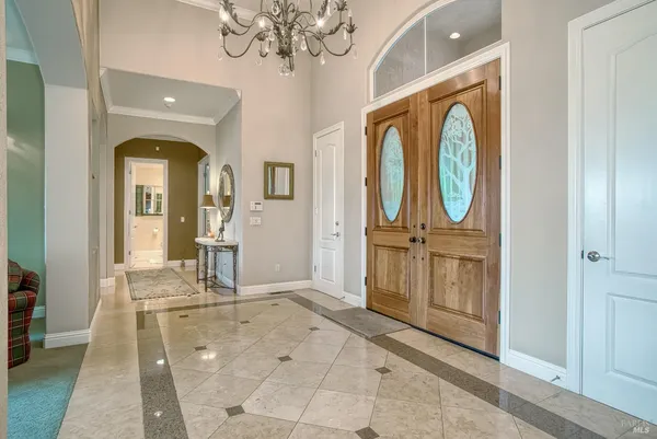a bathroom with a granite countertop sink a toilet a mirror a bathtub and shower