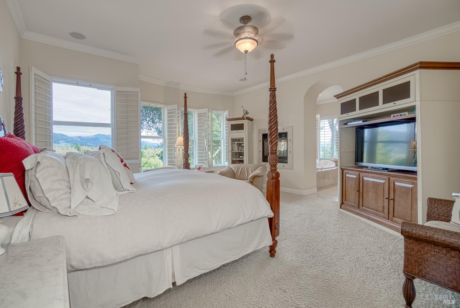 2703 Brush Creek Road Santa Rosa, CA 95404 - Photo 27 of 76 a spacious bedroom with a bed a dresser and flat screen tv