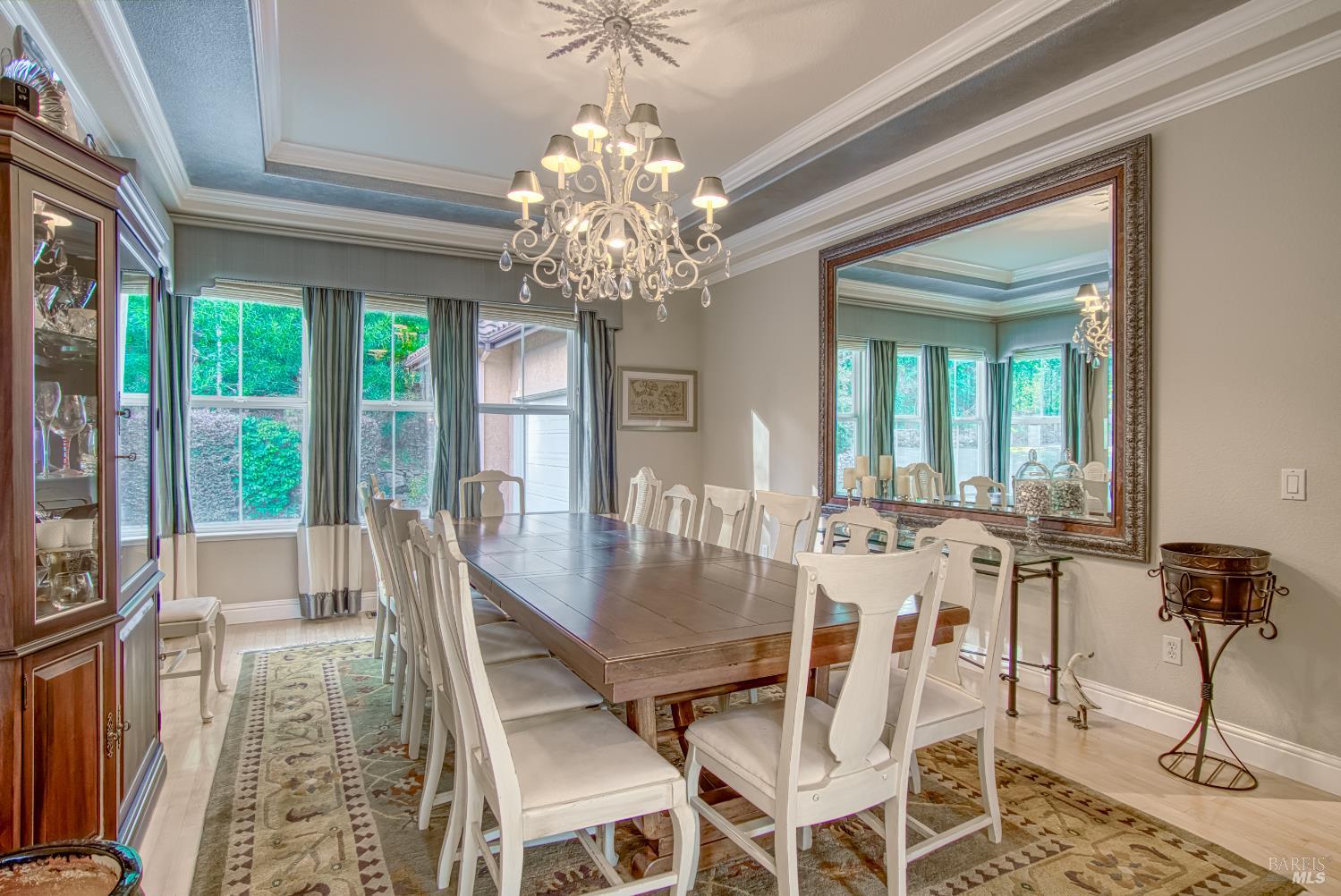2703 Brush Creek Road Santa Rosa, CA 95404 - Photo 33 of 76 a view of a dining room with furniture a chandelier and wooden floor