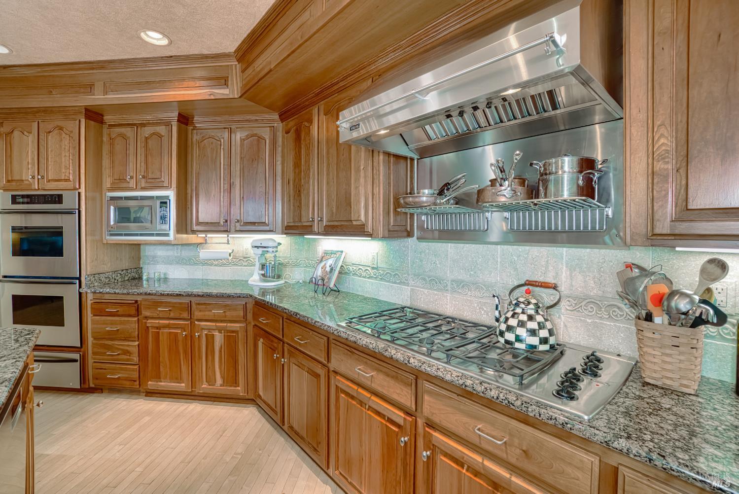 2703 Brush Creek Road Santa Rosa, CA 95404 - Photo 43 of 76 a kitchen with stainless steel appliances granite countertop a sink stove and cabinets