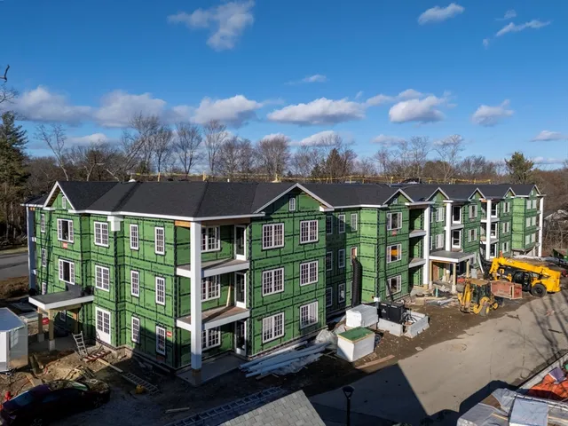 an aerial view of a house with a patio and a fountain