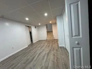 a view of hallway with a wooden floor
