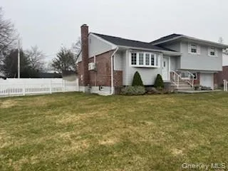 a house view with swimming pool in front of it