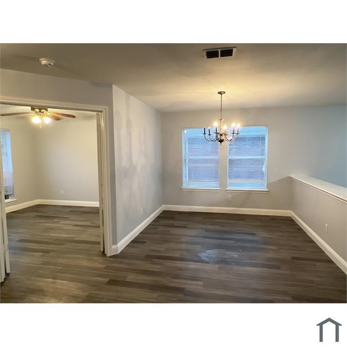 114 Galloping Trail Forney, TX 75126 - Photo 11 of 21 a room with wooden floor and window