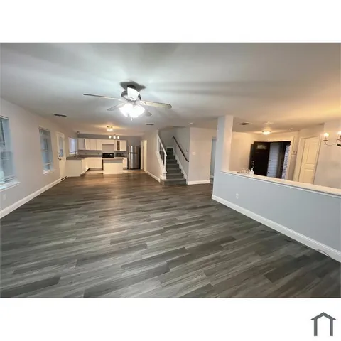 a room with a bed and cabinets