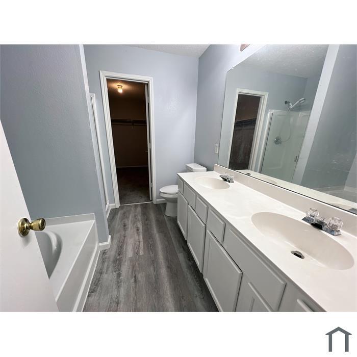 114 Galloping Trail Forney, TX 75126 - Photo 16 of 21 a bathroom with a sink a tub and mirror