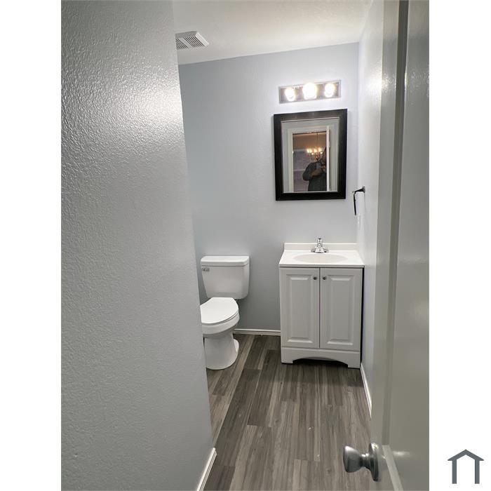 114 Galloping Trail Forney, TX 75126 - Photo 6 of 21 a bathroom with a toilet sink and mirror