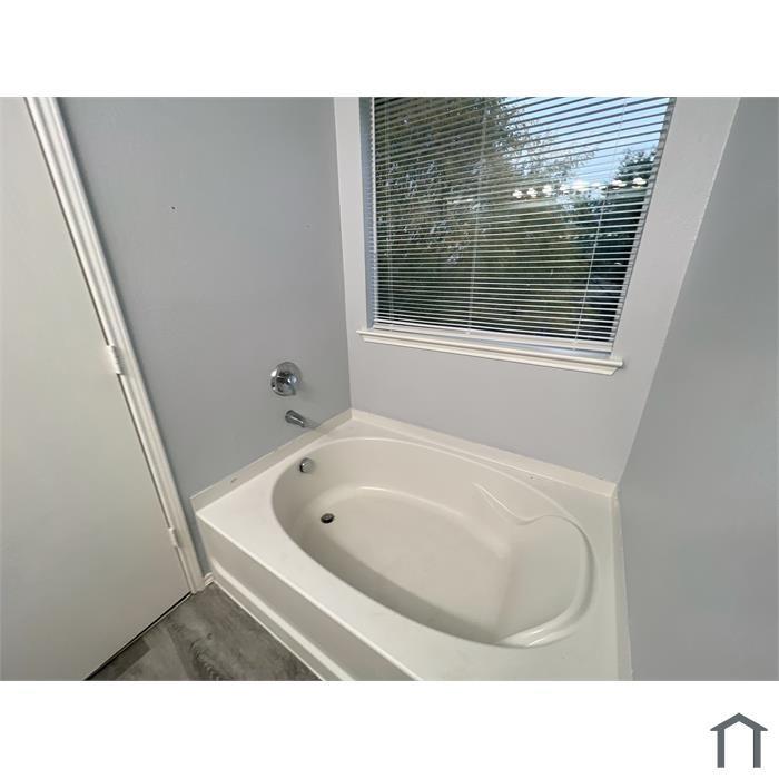 114 Galloping Trail Forney, TX 75126 - Photo 9 of 21 a bathroom with a tub sink and mirror