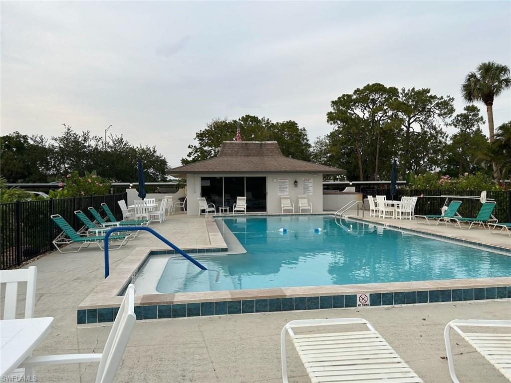 5651 Rattlesnake Hamm Road, Unit C107 Naples, FL 34113 - Photo 18 of 20 COMMUNITY POOL AREA