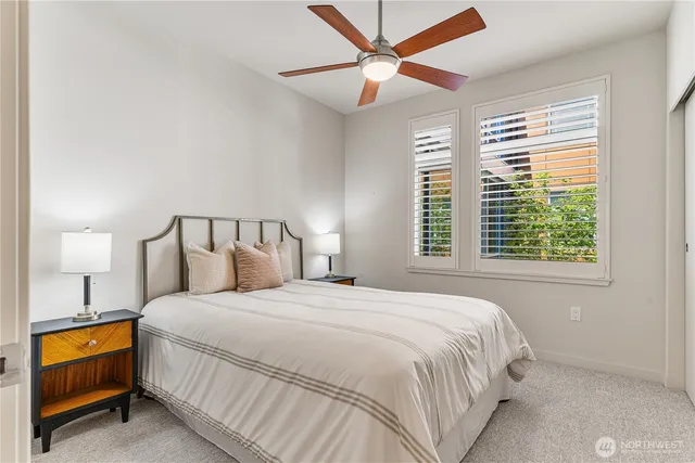 a bedroom with a bed and a lamp