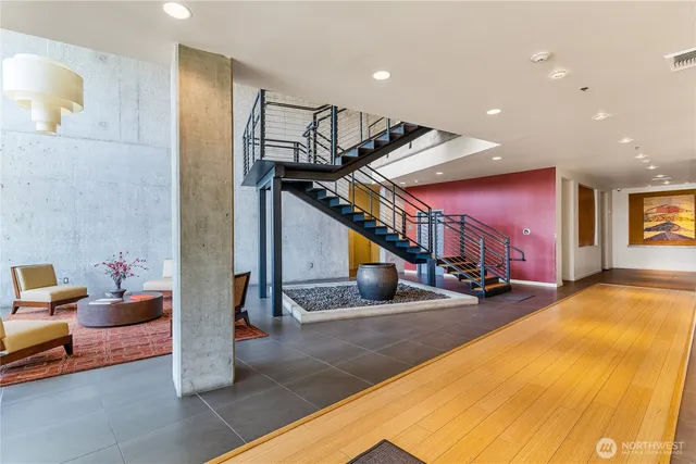 a view of a livingroom with furniture and an empty room