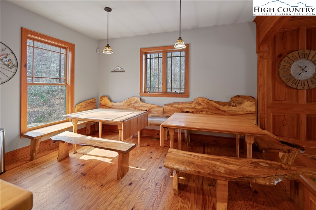 442 Aldridge Road Banner Elk, NC 28604 - Photo 11 of 50 a bedroom with a bed and a table on the wall