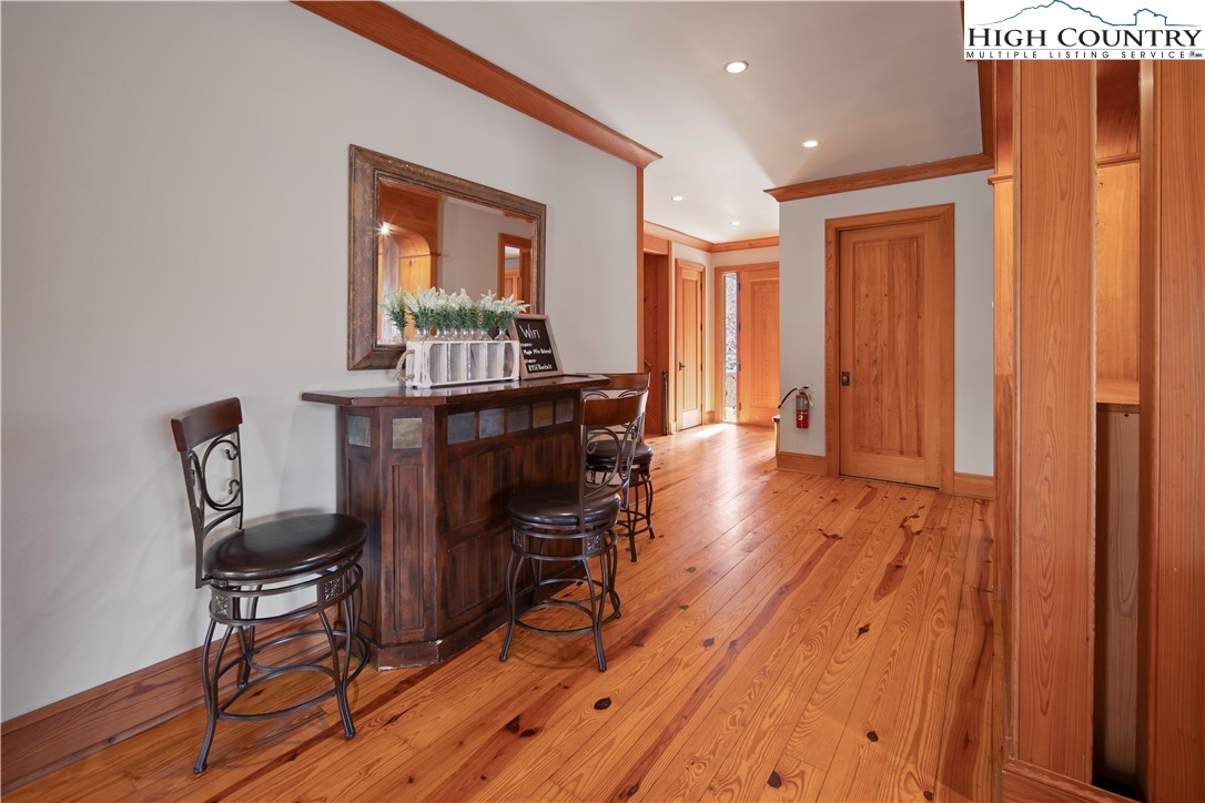442 Aldridge Road Banner Elk, NC 28604 - Photo 14 of 50 a view of a workspace with furniture and wooden floor