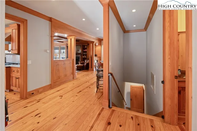 a view of hallway with wooden floor