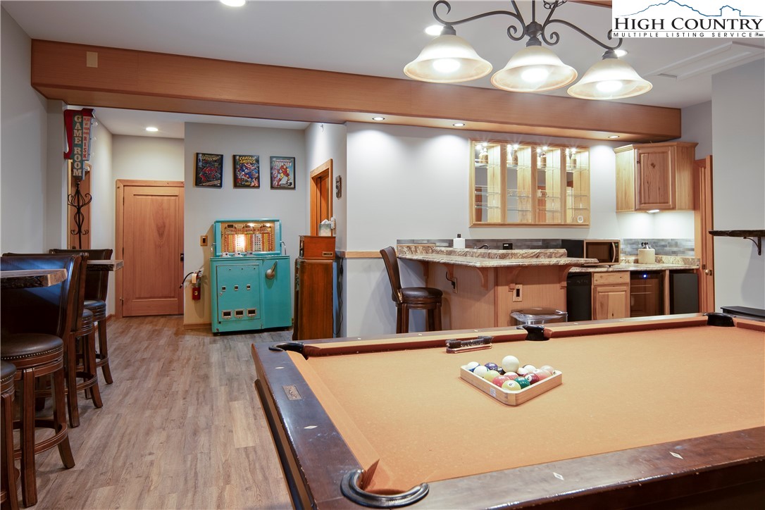 442 Aldridge Road Banner Elk, NC 28604 - Photo 31 of 50 a room with stainless steel appliances kitchen island granite countertop furniture and a large window