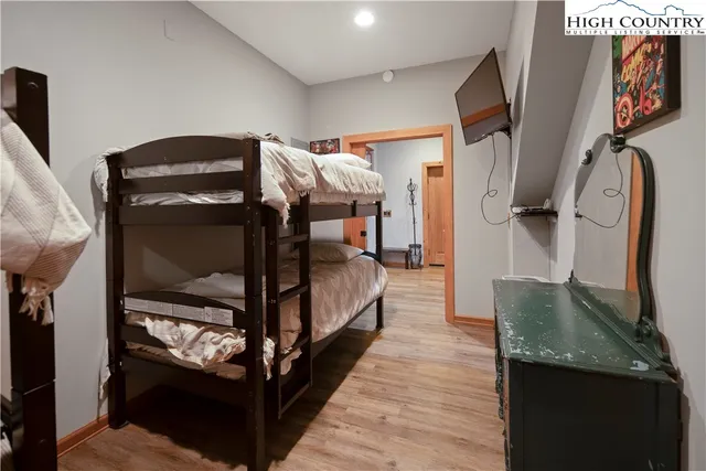 a bedroom with bed and a walk in closet