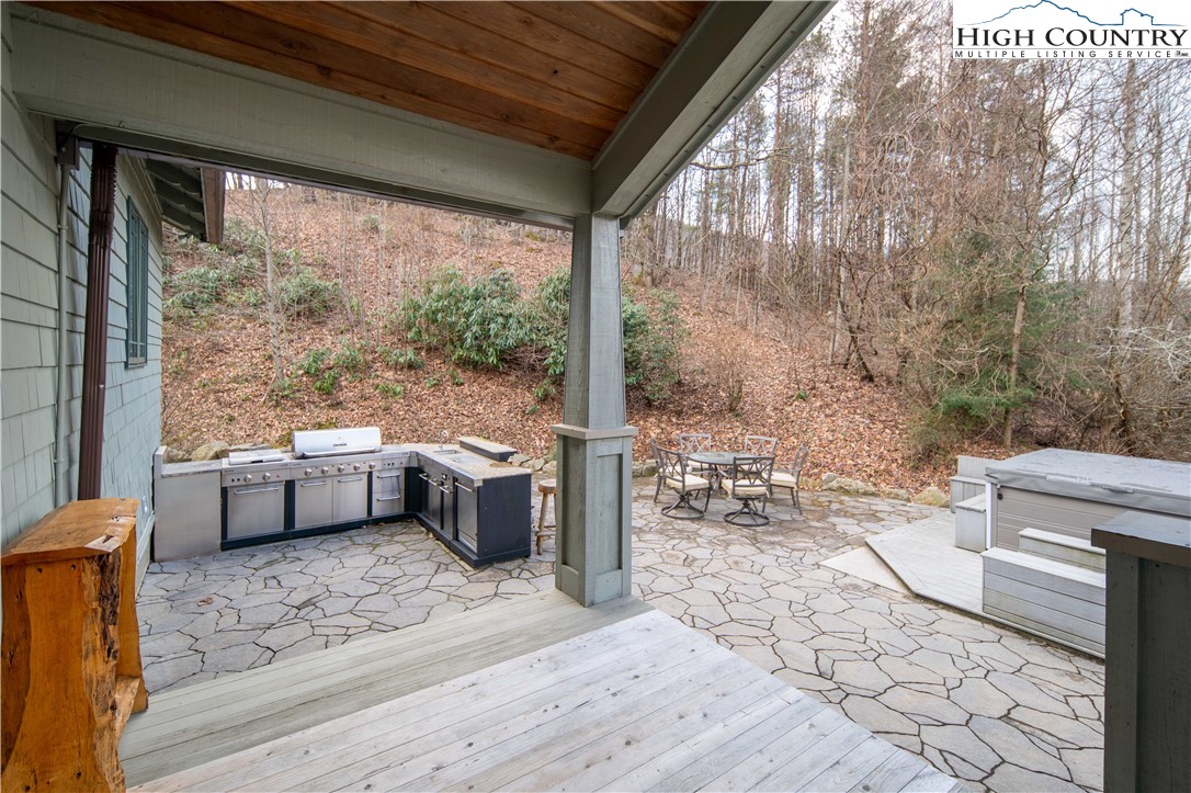 442 Aldridge Road Banner Elk, NC 28604 - Photo 43 of 50 a view of a porch with furniture and wooden floor