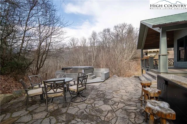 a view of a chairs and table in the patio